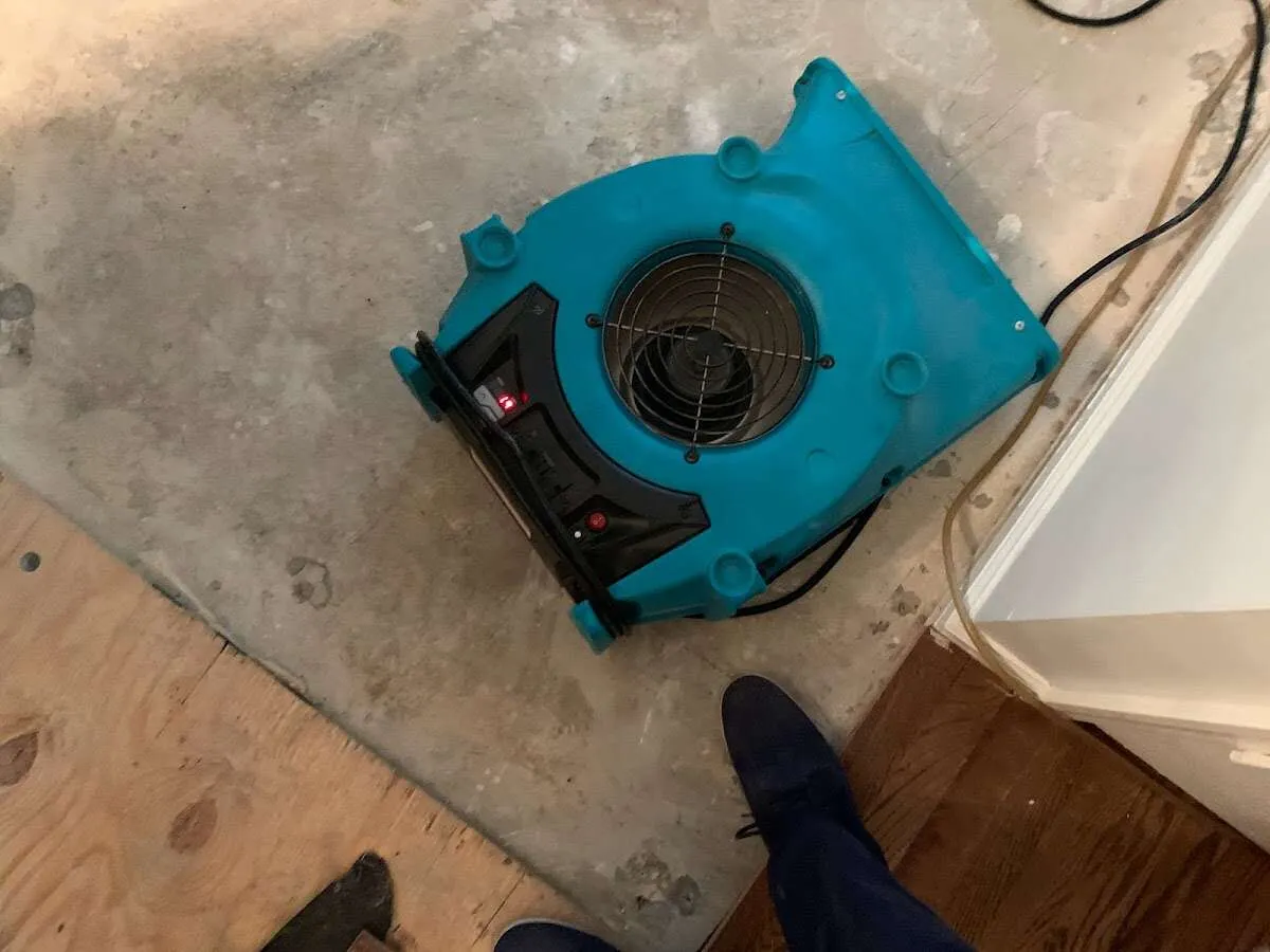 Air mover drying subfloor during Leak Detection & Repair in East Los Angeles